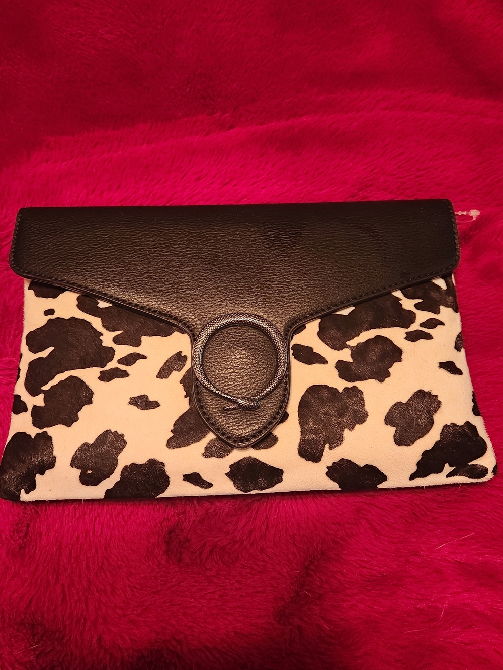 Black and White Cowhide Pattern Clutch with Black Leather Trim